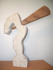 Limestone sculpture with walnut and steel